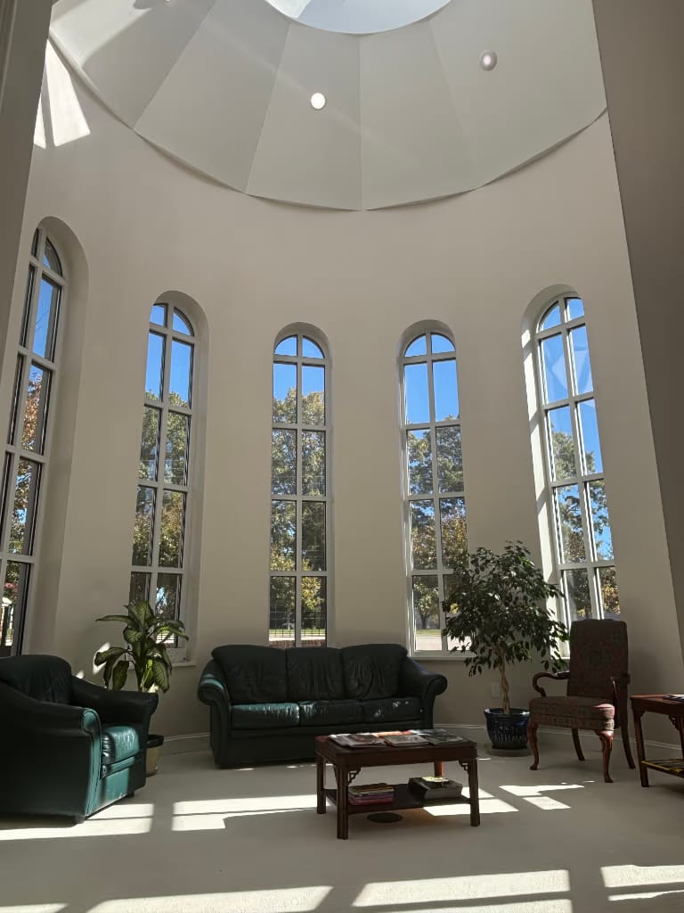 The sunlit patient waiting area inside Cary Plastic Surgery